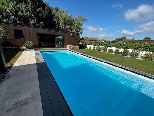 a swimming pool in a yard with a house at Loft vu sur Pommard in Bligny-lès-Beaune