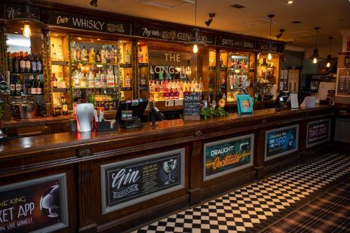 a bar in a pub with a lot of alcohol at The Longship in Hebburn-on-Tyne