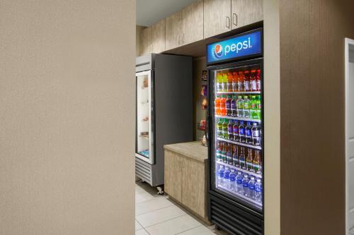 a soda machine in a store with drinks in it at Residence Inn Aberdeen at Ripken Stadium in Aberdeen