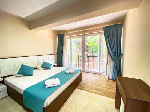 Postel nebo postele na pokoji v ubytování Nokta Belcekız Suit Apart, Fethiye, Ölüdeniz
