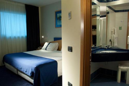 Un pat sau paturi într-o cameră la Hotel Mastai