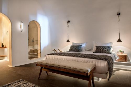a bedroom with two beds and a mirror at Victoria Caves in Vóthon
