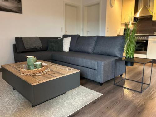 a living room with a couch and a coffee table at Ferienwohnung Ahrblick in Schuld