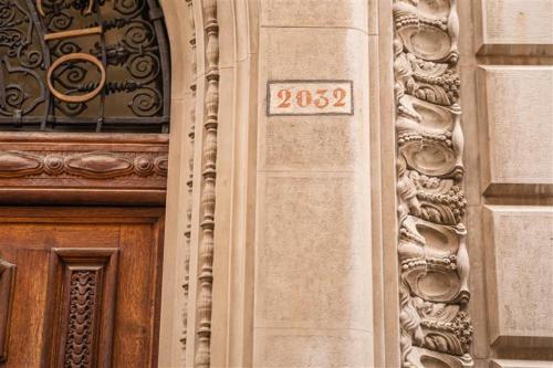 a door of a building with a sign on it at Nolinski Venezia - Evok Collection in Venice
