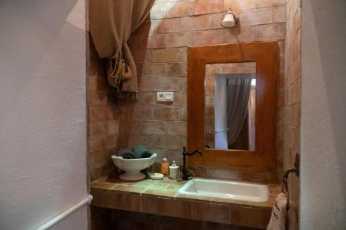 a bathroom with a sink and a mirror at Château de Rosans in Rosans