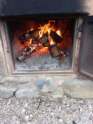 a fire in a brick oven with flames in it at Yasun Gallery in Gyeongju
