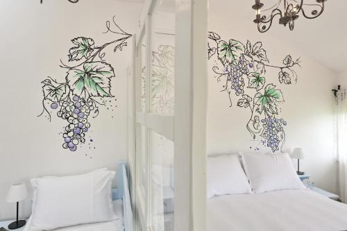 Postel nebo postele na pokoji v ubytování Wine Paradise