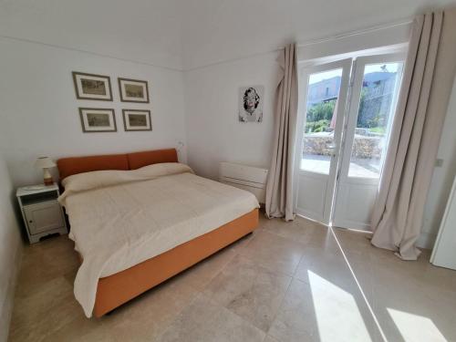 Ένα ή περισσότερα κρεβάτια σε δωμάτιο στο Maridea - Villa Alta Marea