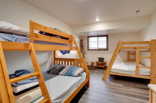 a room with three bunk beds in a house at Lakefront Washington Home with Private Pool and Sauna in Moses Lake