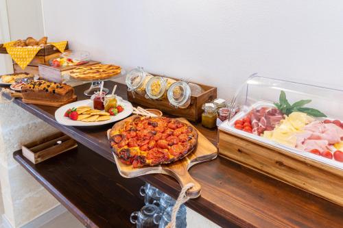 a buffet with many different types of food on a table at Pozzo Traverso Casale in Leporano Marina