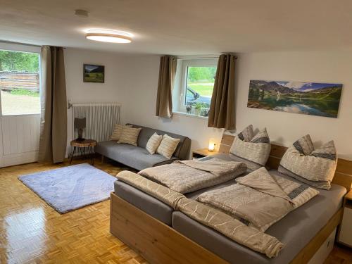 a large living room with a couch at Haus Christina in Döllach