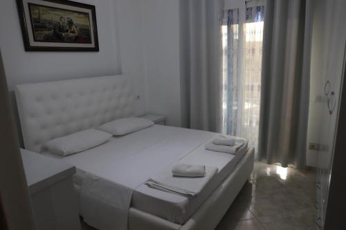 Giường trong phòng chung tại Gimi Apartments 2