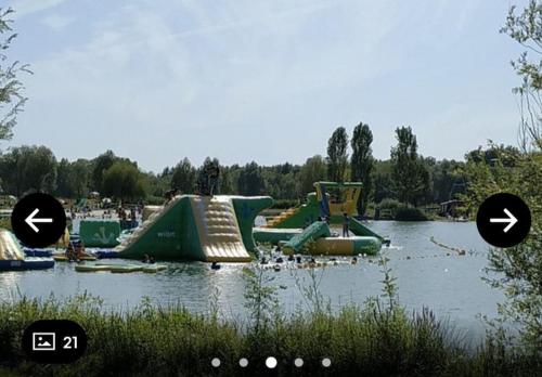 a water park with a slide in the water at Studio sur la plage des Dagueys in Libourne