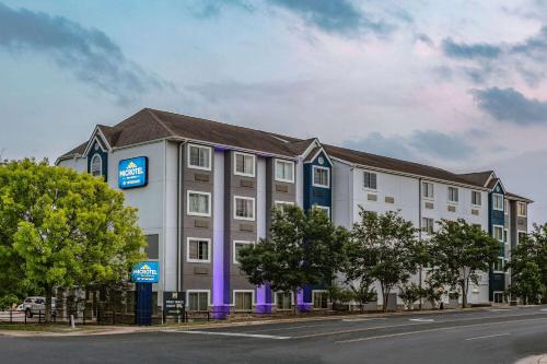 a rendering of the exterior of a hotel at Microtel Inn & Suites by Wyndham Austin Airport in Austin