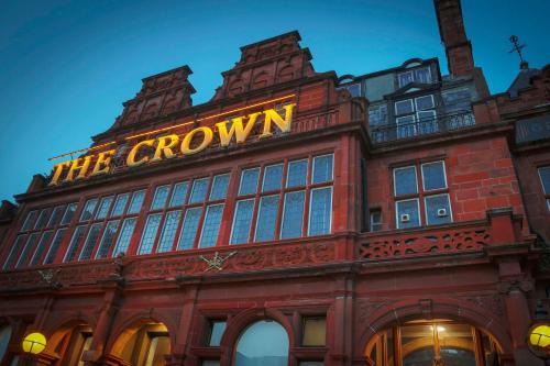 a building with a neon sign on top of it at The Crown London, WorldHotels Distinctive in London