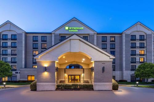 a rendering of the front of a hotel at Wyndham Garden Kansas City Airport in Kansas City