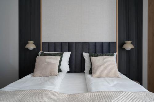 Ένα ή περισσότερα κρεβάτια σε δωμάτιο στο Symphony Modern Tower Apartamenty