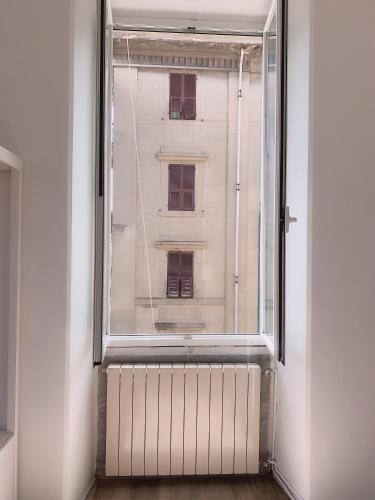 an open window with a view of a building at Brin home in La Spezia