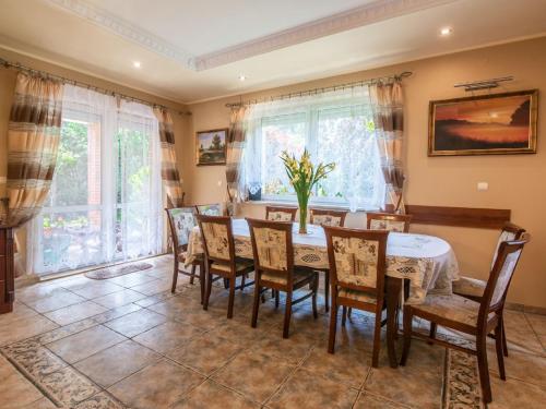 a dining room with a table and chairs at Holiday Home Villa Bieszkowice by Interhome in Bieszkowice