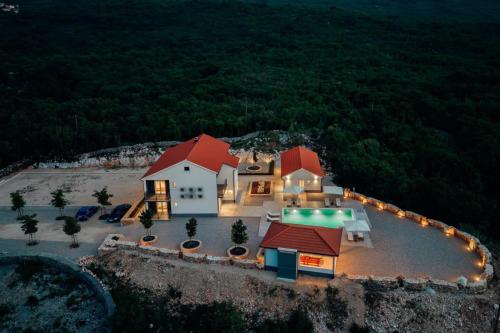 an aerial view of a house with lights at Vila Agape in Lovreć