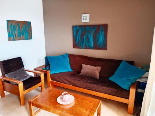 a living room with a couch and a table at FELIX HOUSE sea views in Costa de Antigua