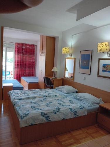 a bedroom with a large bed in a room at Vila Centar in Trebinje