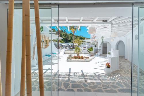 a view of a courtyard from inside a building at Aloe Hotel - Adults Only in Faliraki