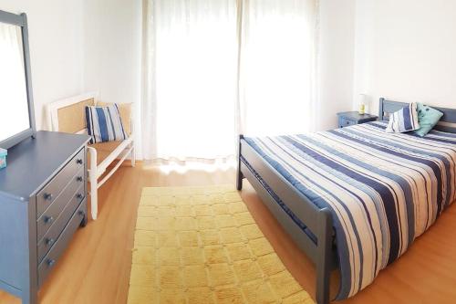 En eller flere senge i et værelse på Casa de Praia acolhedora/ Cosy beach house