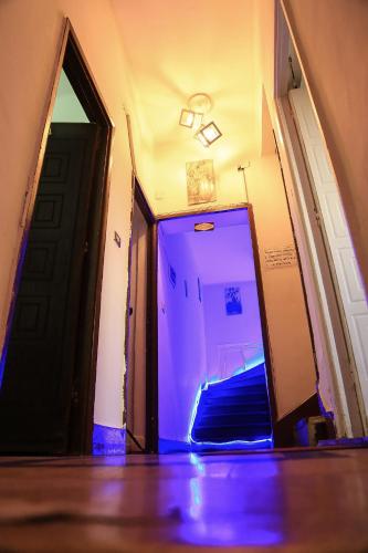 a hallway with a blue light in a room at Castle Hotel in Cairo