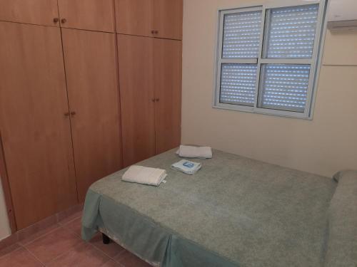 Una cama o camas en una habitación de Departamentos Niñas