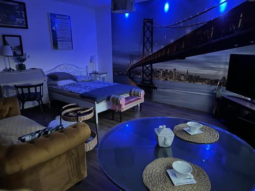 a living room with a bed and a bridge at Apartament Awiator Gdańsk in Gdańsk