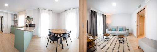 a kitchen and a living room with a table at Apartamentos Villa Zoila Nigrán in Nigrán