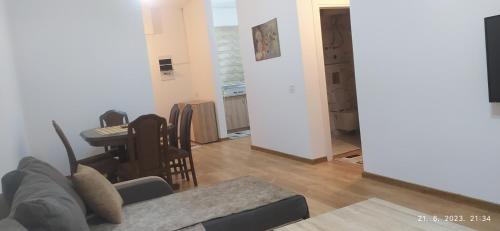 a living room with a couch and a table at Apartments Radoman in Ulcinj