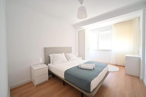 Postel nebo postele na pokoji v ubytování Skyline Apartment