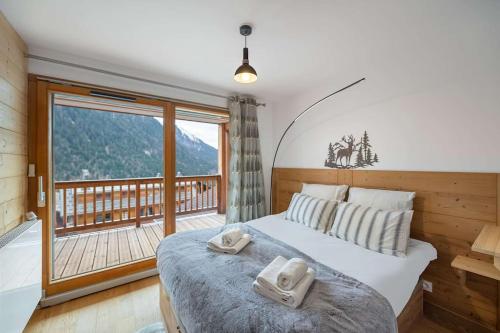 Ένα ή περισσότερα κρεβάτια σε δωμάτιο στο Perle de Savoie - APT A204 - BO IMMOBILIER - Châtel -Reduced prices on ski passes Châtel & Portes du Soleil