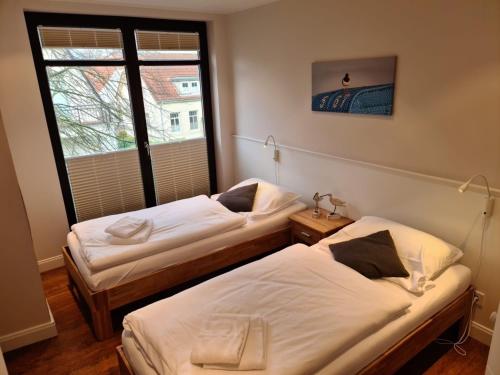 Posteľ alebo postele v izbe v ubytovaní Rothtraut Remise Whg4