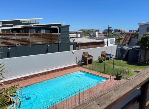 a swimming pool on the roof of a house at Casual, beachy and 100m to Seals Surf Spot in Cape St Francis