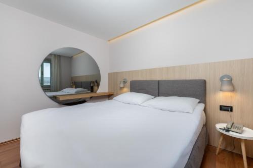 Postel nebo postele na pokoji v ubytování Hotel Nostromo