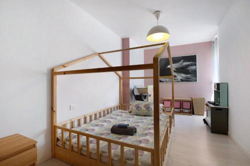 a bedroom with a bunk bed in a room at Medano Beach Home Ocean View in El Médano
