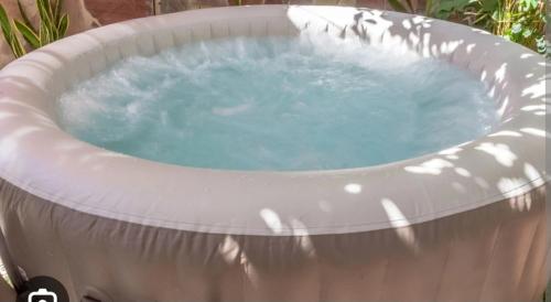 a large hot tub in a garden with at New Holiday House, near Makarska in Grubine
