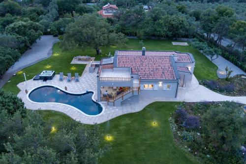 an aerial view of a house with a pool at Villa Golden Root Real Estate in San Teodoro