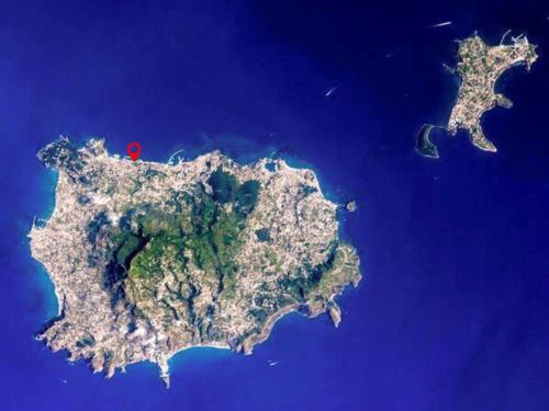 an island in the ocean with a red spot at Casa Verdemare in Ischia