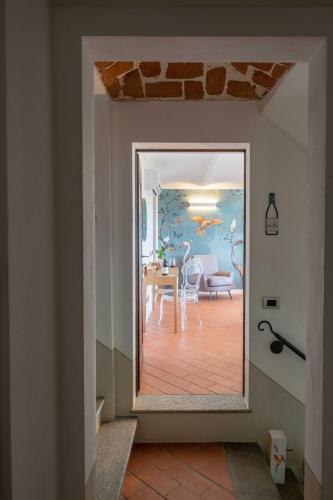 a room with a table and a dining room at Braida Wine Resort in Rocchetta Tanaro