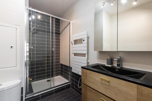 a bathroom with a sink and a shower at DIFY Duguesclin - Quai du Rhone in Lyon