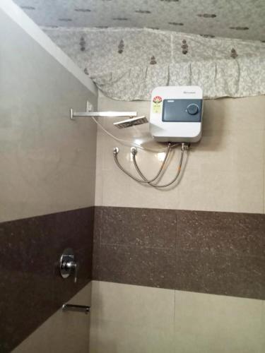 a bathroom with a scale on the floor of a room at Virat Resorts, Sariska Rajasthan in Bairāt