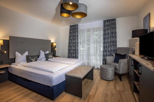 Letto o letti in una camera di Hubertus Appartements Inzell