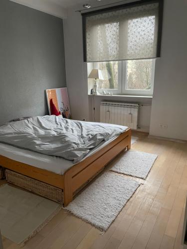Posteľ alebo postele v izbe v ubytovaní Apartament Koszykowa 1