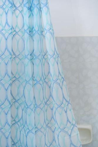 a blue glass vase sitting on top of a table at Cozy Apartment 2 in Sitia