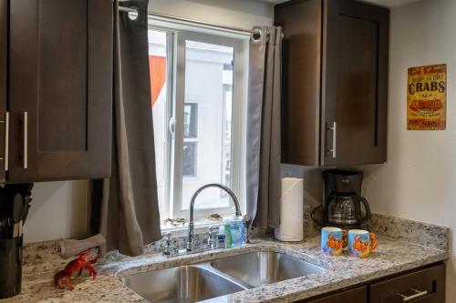 a kitchen counter with a sink and a window at H - Crab Shack in Fort Bragg