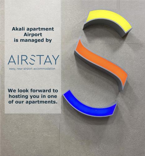 a sign for an airport is marked by an arrow at Akali Apartment airport by Airstay in Spáta